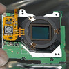 SmugMug > keywords > before > E-1 IR-conversion:
The sensor board with the dust filter in front of the IR/AA-filter and the sensor.